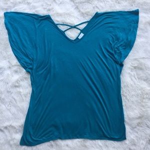 Turquoise T-shirt with cage back. Medium.